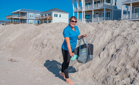 Staff cleaning beachfront
